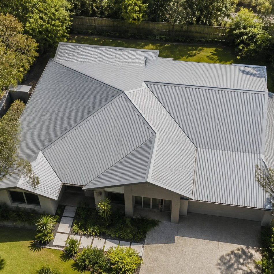 aerial view of a new Australian home with a pale grey Colorbond hip roof